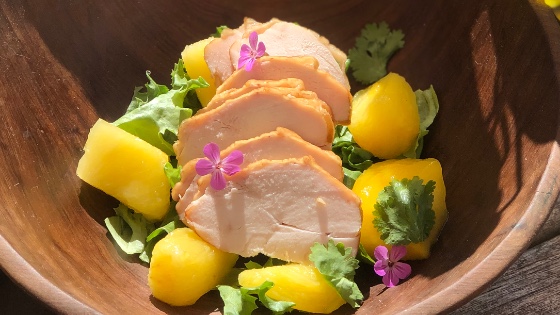 Smoked Chicken and Mango Salad with edible flowers 